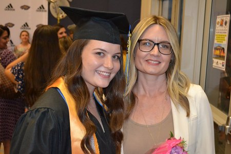 Newly-minted LMCHS grad, Toni  Rocha, celebrates with mom Kalli Rocha who teaches English at Lemoore High School.